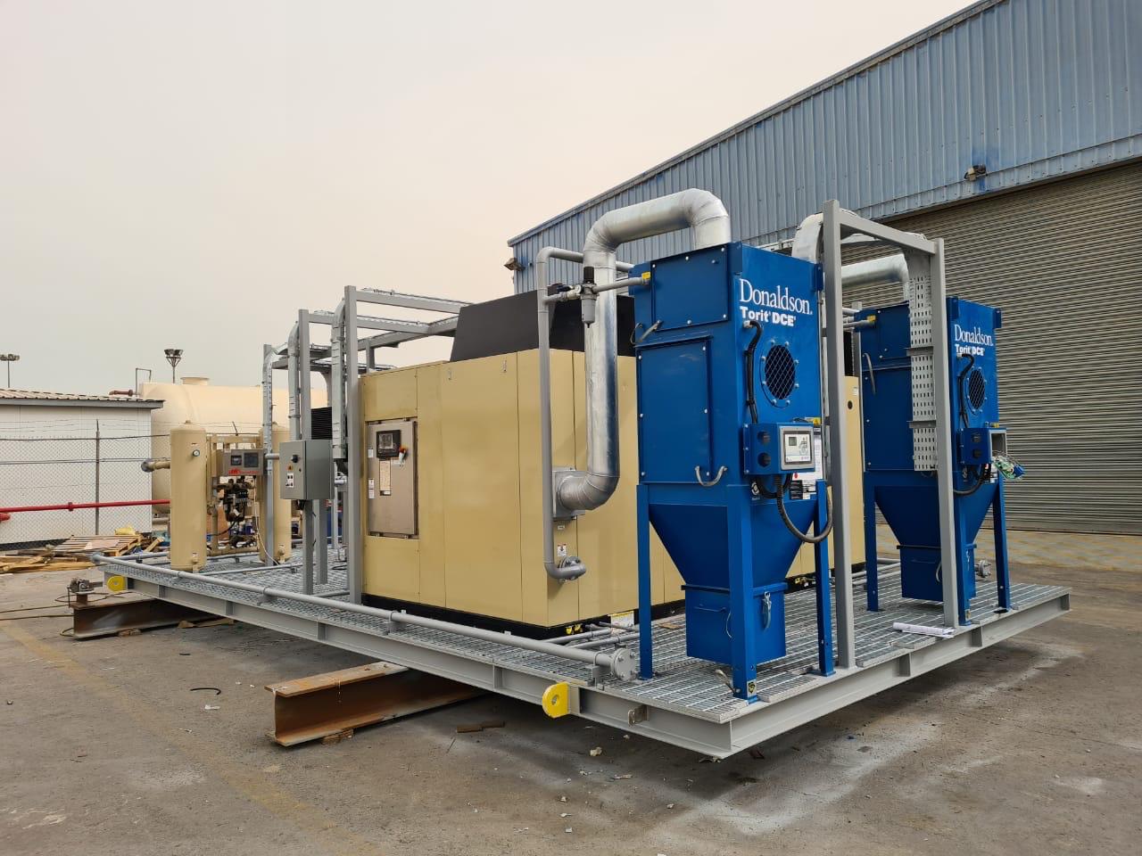 Compressed air and dust collection skid staged in the yard