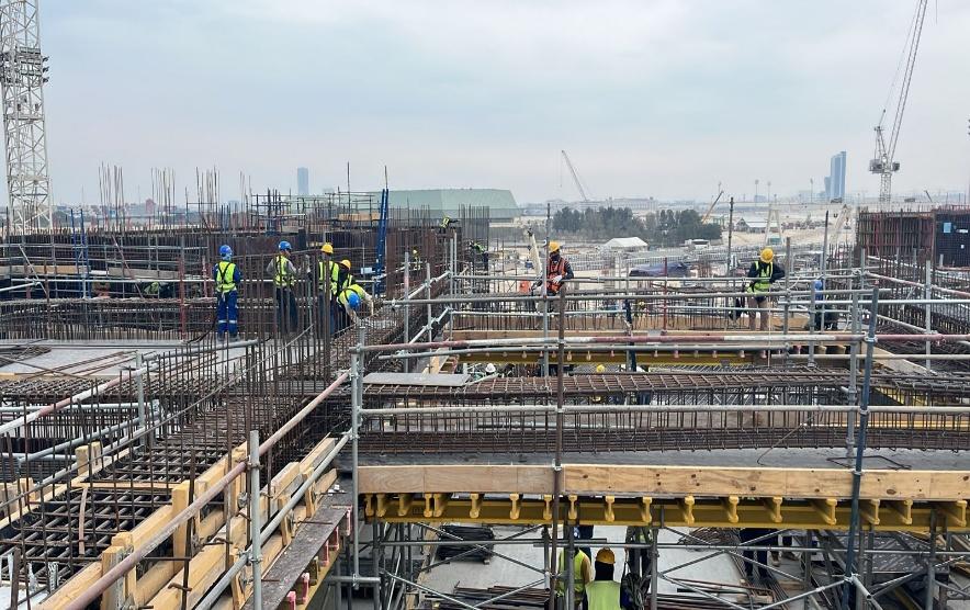 Elevated formwork decks across the structural frame