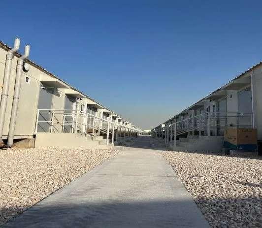 Rows of accommodation units across the camp